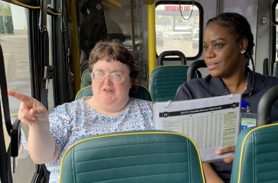 Travel trainer with rider on bus